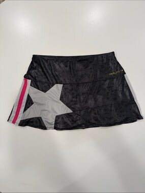 Lucky in Love Tennis Skirt. Black Star-Accent Skirt with Pink Stripe